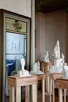 Display of classic sculptures on wooden plinths