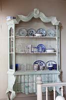 Blue and white crockery displayed in dresser