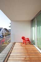 Modern balcony with red sculpture