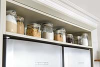 Storage jars on kitchen shelf