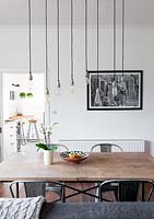 Pendant lights above dining table
