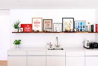 Colourful art display on kitchen shelf