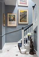 Framed posters on staircase walls