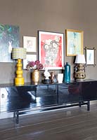 Colourful accessories on black sideboard