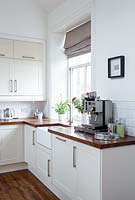 Coffee machine on wooden kitchen counter