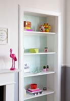 Colourful accessories on wooden shelves