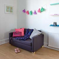 Colourful accessories on compact sofa