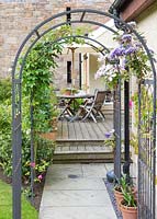 Arch with clematis growing up it
