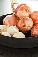 Onions in black bowl