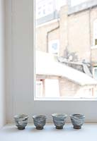 Pottery bowls on windowsill