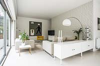 White living room with resin flooring