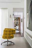 Yellow armchair on resin floor