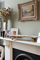 Toile de Jouey covered skateboard on mantlepiece
