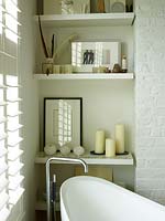 Freestanding bath in bedroom corner