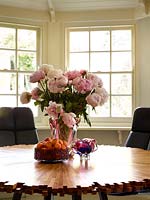 Vase of Peony flowers on dining table