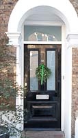 Classic front door with christmas wreath