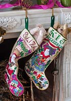 Christmas stockings hanging by fireplace