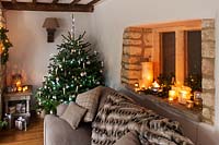 Christmas tree by sofa
