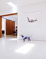 Dog sculpture on white floor