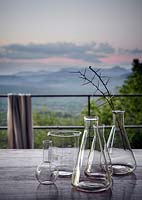 Glass beakers on garden table