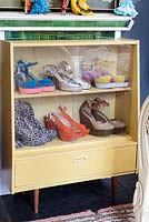 Shoes in display cabinet