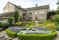 Farmhouse and formal garden with parterre