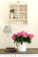 Feminine accessories on console table