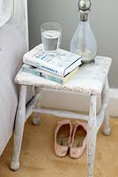 Wooden stool used as bedside table