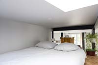 Compact bedroom on mezzanine