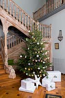Christmas tree by staircase