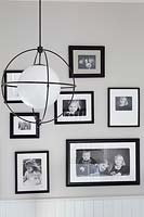 Black and white photo display on hall wall