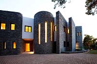Contemporary house lit up at dusk