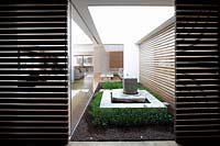 Compact courtyard garden with water feature