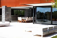 Patio area by contemporary house