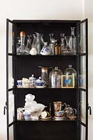 Glassware in black cabinet