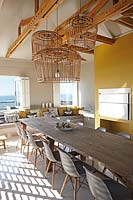 Cane pendant lights in dining room