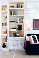 White bookshelves with compact desk