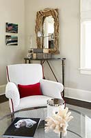 White armchair with red cushion