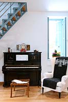 Upright piano in music room