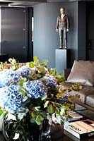 Vase of Hydrangea flowers on coffee table
