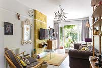Colourful living room with modern and vintage furniture