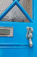 Painted front door with quirky door knocker