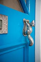 Painted front door with quirky door knocker