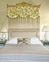 Ornate canopy above bed