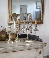 Silver accessories on sideboard