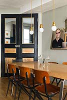 Modern pendant lights above dining table