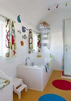 Modern bathroom with colourful toys and ornaments