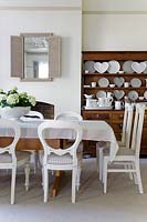 Painted chairs at dining table