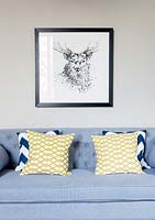 Patterned cushions on grey sofa
