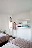 Modern bedroom with built in shelving